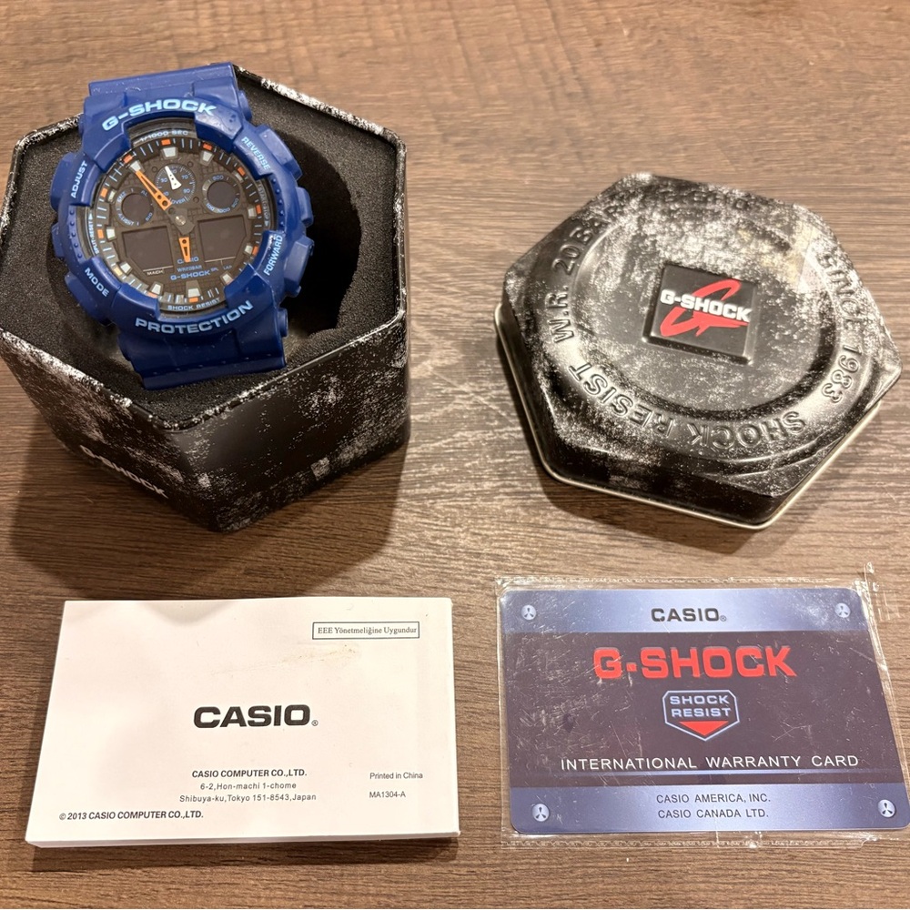 G-Shock Blue Resin Watch with Black and Orange Dial Accents